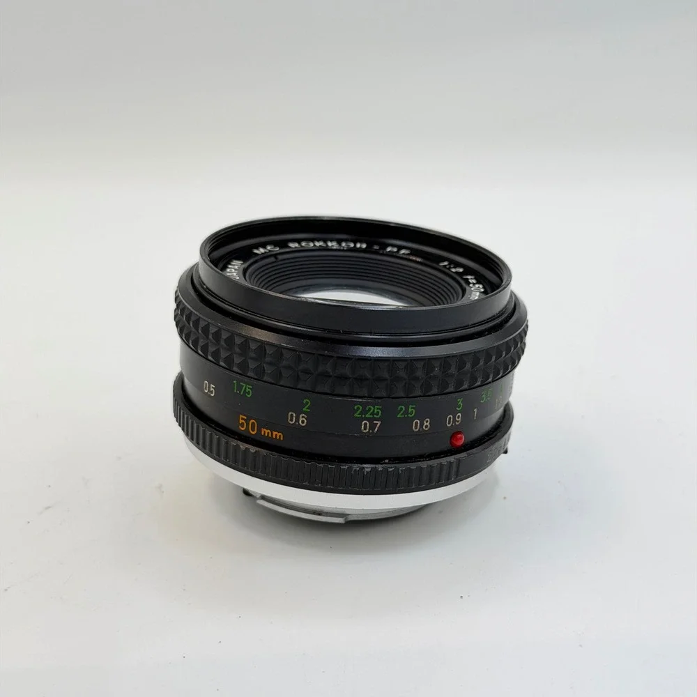 Minolta MC Rokkor-PF 50mm f/2 Lens with 55mm Skylight 1A Hood SR Mount 1126884